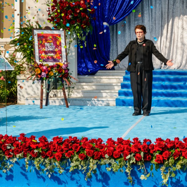 Tennis great Billie Jean King gestures as she is introduced by Roses President Ed Morales, left, as grand marshal of the 136th Rose Parade next year on the front steps of the Tournament House in Pasadena, Calif., Monday, Oct. 7, 2024. (AP Photo/Damian Dovarganes)