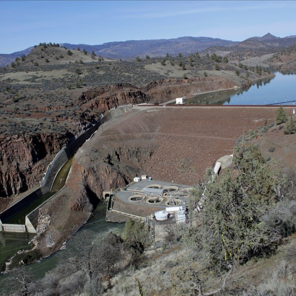 FILE - The Iron Gate Dam powerhouse and spillway are seen on the lower Klamath River near Hornbrook, Calif., March 2, 2020. (AP Photo/Gillian Flaccus, File)