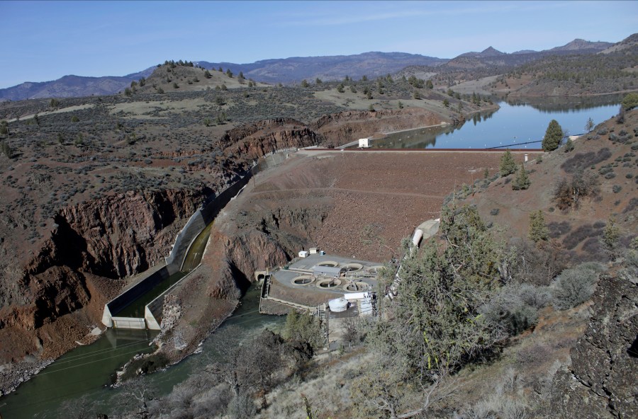 FILE - The Iron Gate Dam powerhouse and spillway are seen on the lower Klamath River near Hornbrook, Calif., March 2, 2020. (AP Photo/Gillian Flaccus, File)