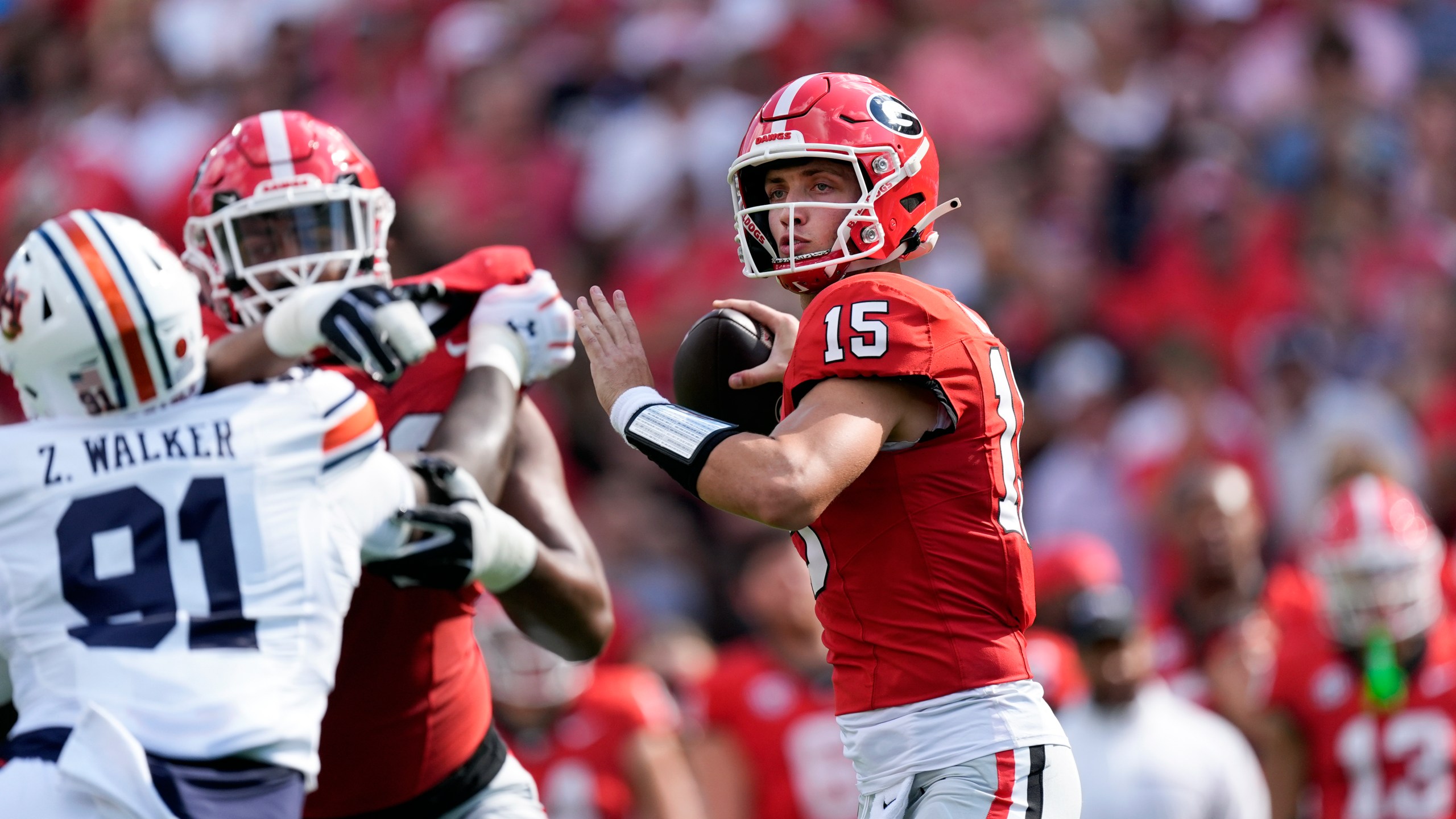 Georgia quarterback Carson Beck (15) throws from the pocket in the first half of an NCAA college football game against Auburn Saturday, Oct. 5, 2024, in Athens, Ga. (AP Photo/John Bazemore)