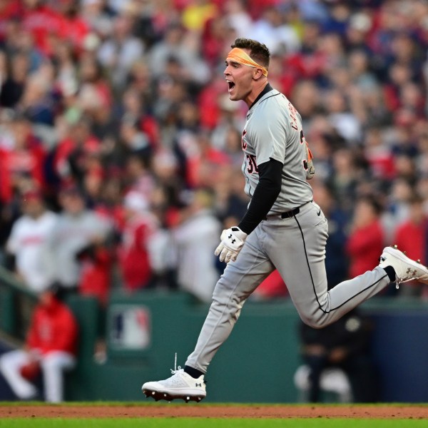 Detroit Tigers' Kerry Carpenter celebrates as he runs the bases with a three-run home run in the ninth inning during Game 2 of baseball's AL Division Series against the Cleveland Guardians, Monday, Oct. 7, 2024, in Cleveland. (AP Photo/David Dermer)