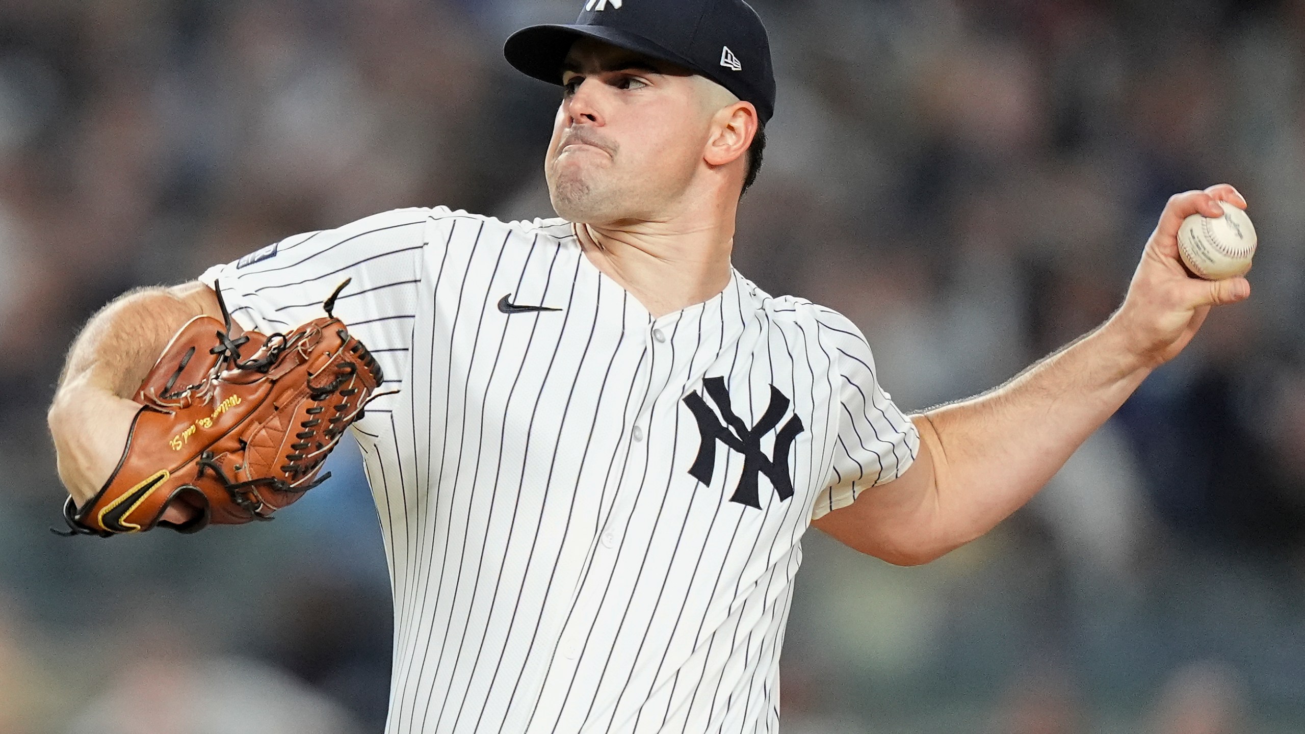 New York Yankees pitcher Carlos Rodón delivers against the Kansas City Royals during the first inning of Game 2 of the American League baseball playoff series, Monday, Oct. 7, 2024, in New York. (AP Photo/Frank Franklin II)