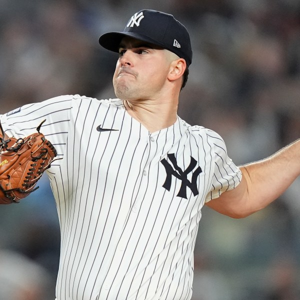 New York Yankees pitcher Carlos Rodón delivers against the Kansas City Royals during the first inning of Game 2 of the American League baseball playoff series, Monday, Oct. 7, 2024, in New York. (AP Photo/Frank Franklin II)