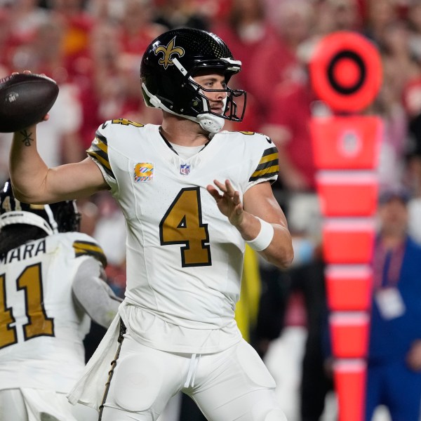 New Orleans Saints quarterback Derek Carr throws during the first half of an NFL football game against the Kansas City Chiefs Monday, Oct. 7, 2024, in Kansas City, Mo. (AP Photo/Ed Zurga)