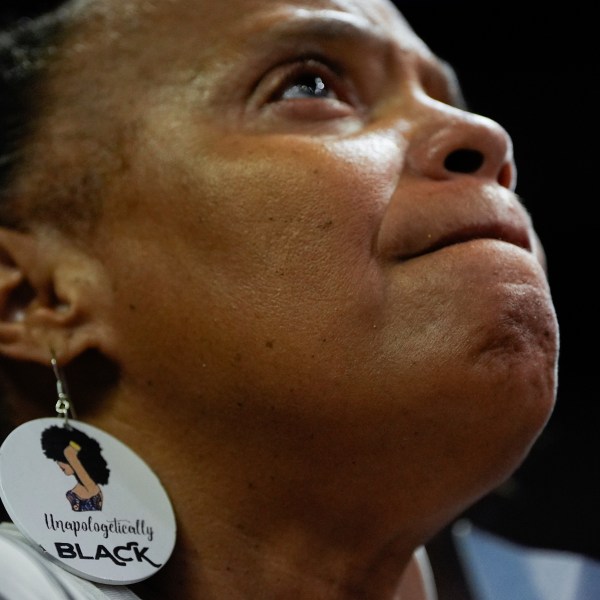 FILE - A supporter wearing earrings that read "Unapologetically Black" listens during a campaign rally for Democratic presidential nominee Vice President Kamala Harris, Aug. 10, 2024, in Las Vegas. (AP Photo/Julia Nikhinson, File)