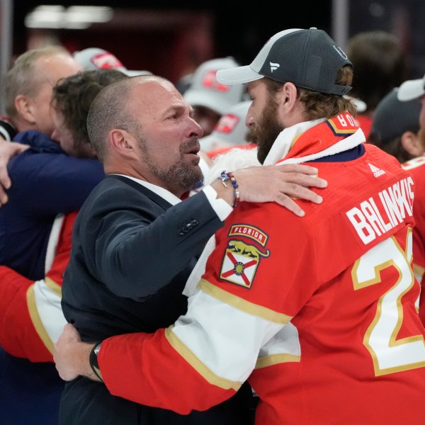 FILE - Florida Panthers general manager Bill Zito talks to defenseman Uvis Balinskis (26) after Game 7 of the NHL hockey Stanley Cup Final against the Edmonton Oilers, on June 24, 2024, in Sunrise, Fla. (AP Photo/Wilfredo Lee, File)