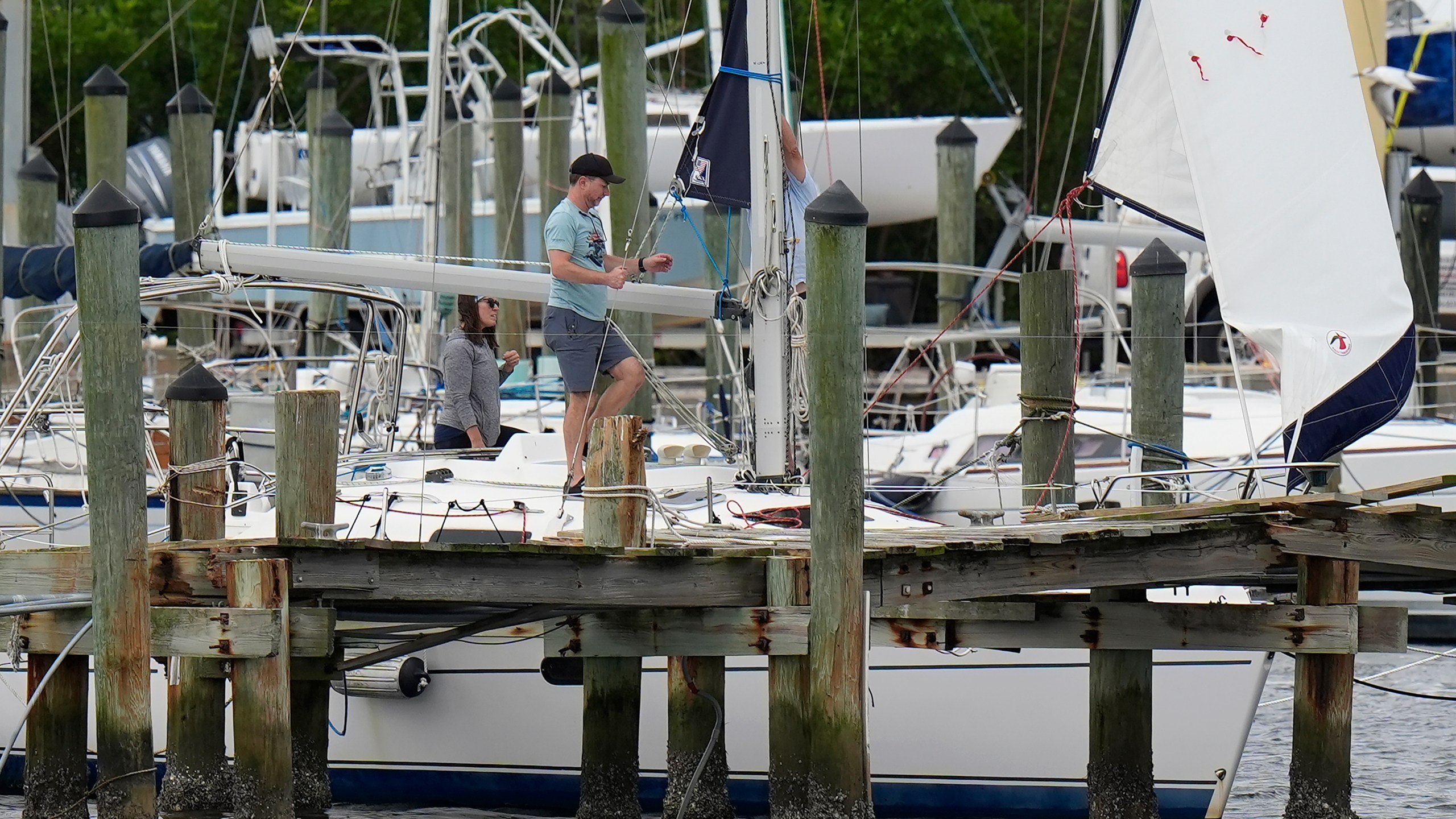 Owners try to secure their boat at the Davis Islands Yacht Clubs ahead a possible landfall by Hurricane Milton, Monday, Oct. 7, 2024, in Tampa, Fla. (AP Photo/Chris O'Meara)