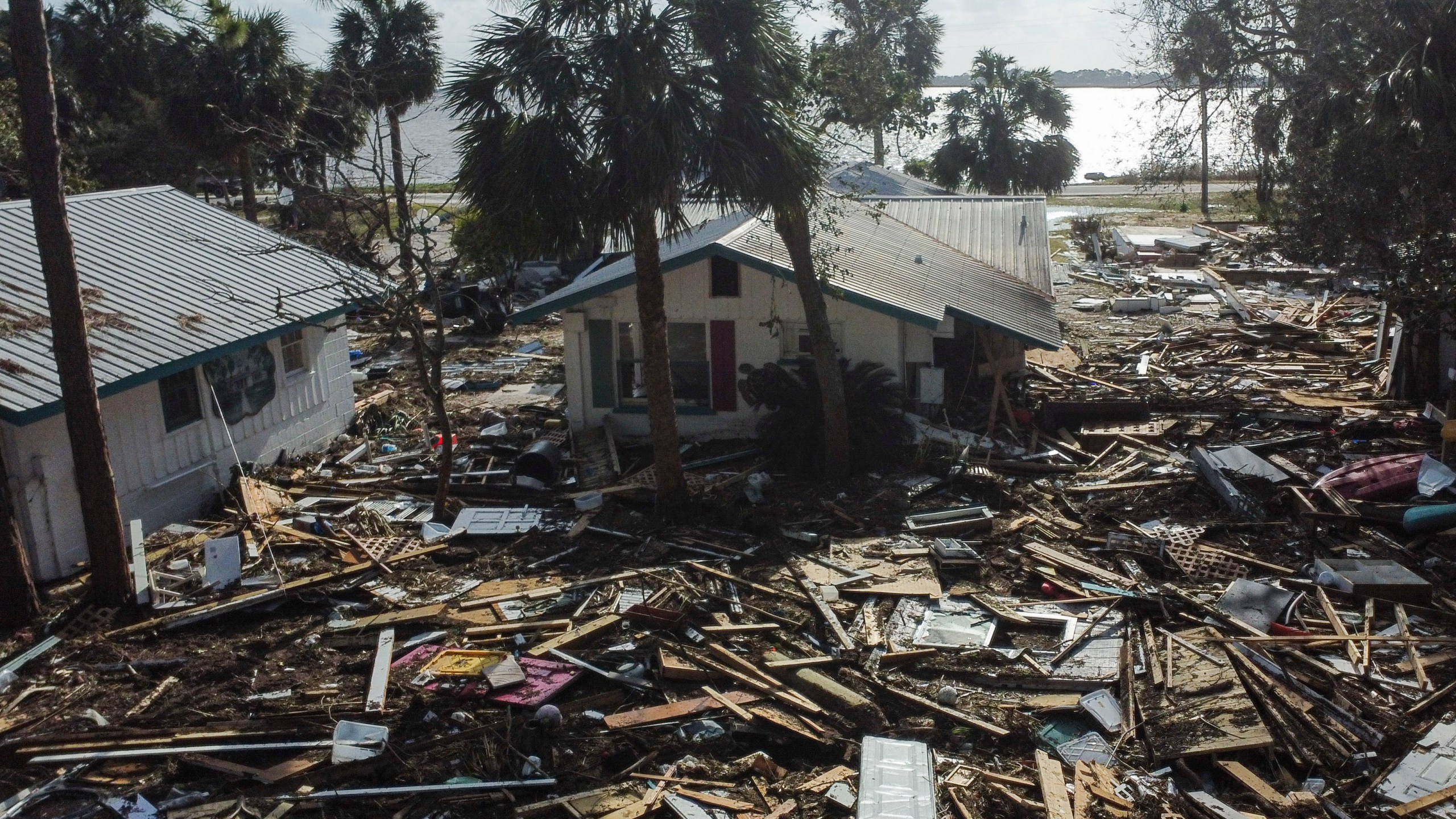 FILE - Debris surrounds the Faraway Inn Cottages and Motel in the aftermath of Hurricane Helene, in Cedar Key, Fla., Sept. 27, 2024. (AP Photo/Stephen Smith, File)