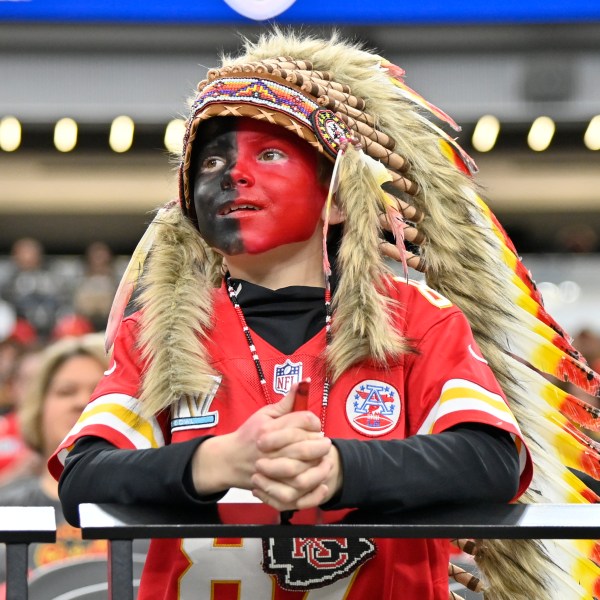 FILE - A young Kansas City Chiefs fan, dressed with a headdress and face paint, looks on during an NFL football game against the Las Vegas Raiders, Sunday, Nov. 26, 2023, in Las Vegas. (AP Photo/David Becker, File)