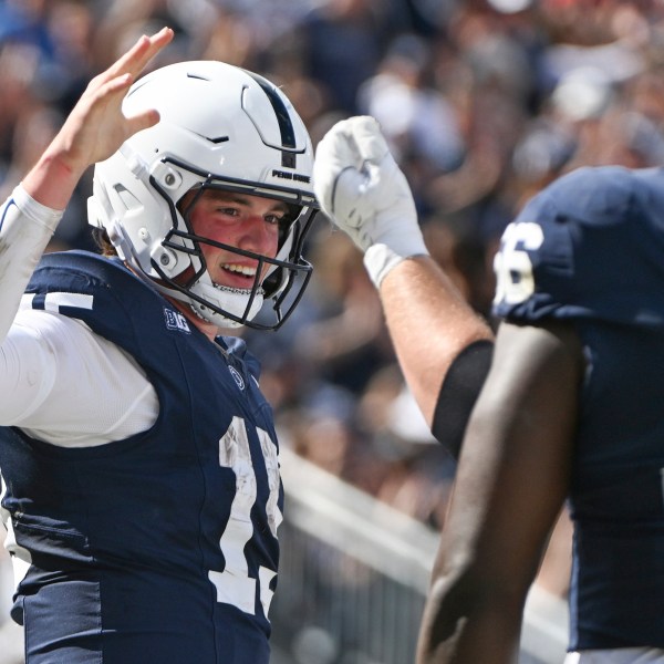 Penn State quarterback Drew Allar (15) celebrates a touchdown during the first half of an NCAA college football game against UCLA Saturday, Oct. 5, 2024, in State College, Pa. (AP Photo/Barry Reeger)