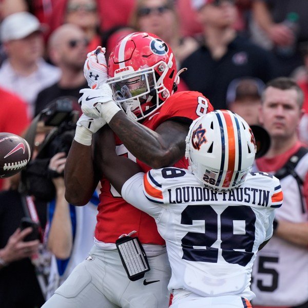 Auburn safety Kensley Louidor-Faustin (28) breaks up a pass intended for Georgia wide receiver Colbie Young (8) in the first half of an NCAA college football game Saturday, Oct. 5, 2024, in Athens, Ga. (AP Photo/John Bazemore)