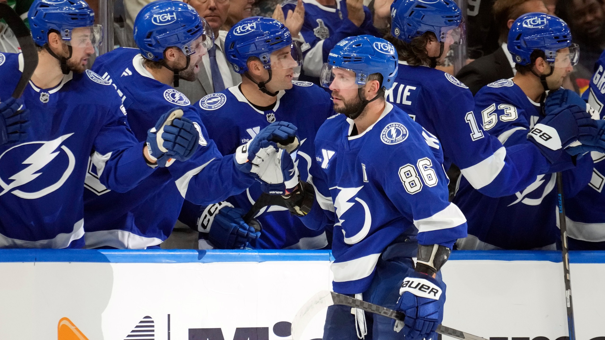 Tampa Bay Lightning right wing Nikita Kucherov (86) celebrates with the bench after his goal against the Florida Panthers during the third period of an NHL preseason hockey game Wednesday, Oct. 2, 2024, in Tampa, Fla. (AP Photo/Chris O'Meara)