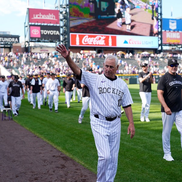 Colorado Rockies manager Bud Black waves to the crowd during the team's ceremonial walk around the field to acknowledge fans following a loss in the team's season finale Sunday, Sept. 29, 2024, in Denver. (AP Photo/David Zalubowski)