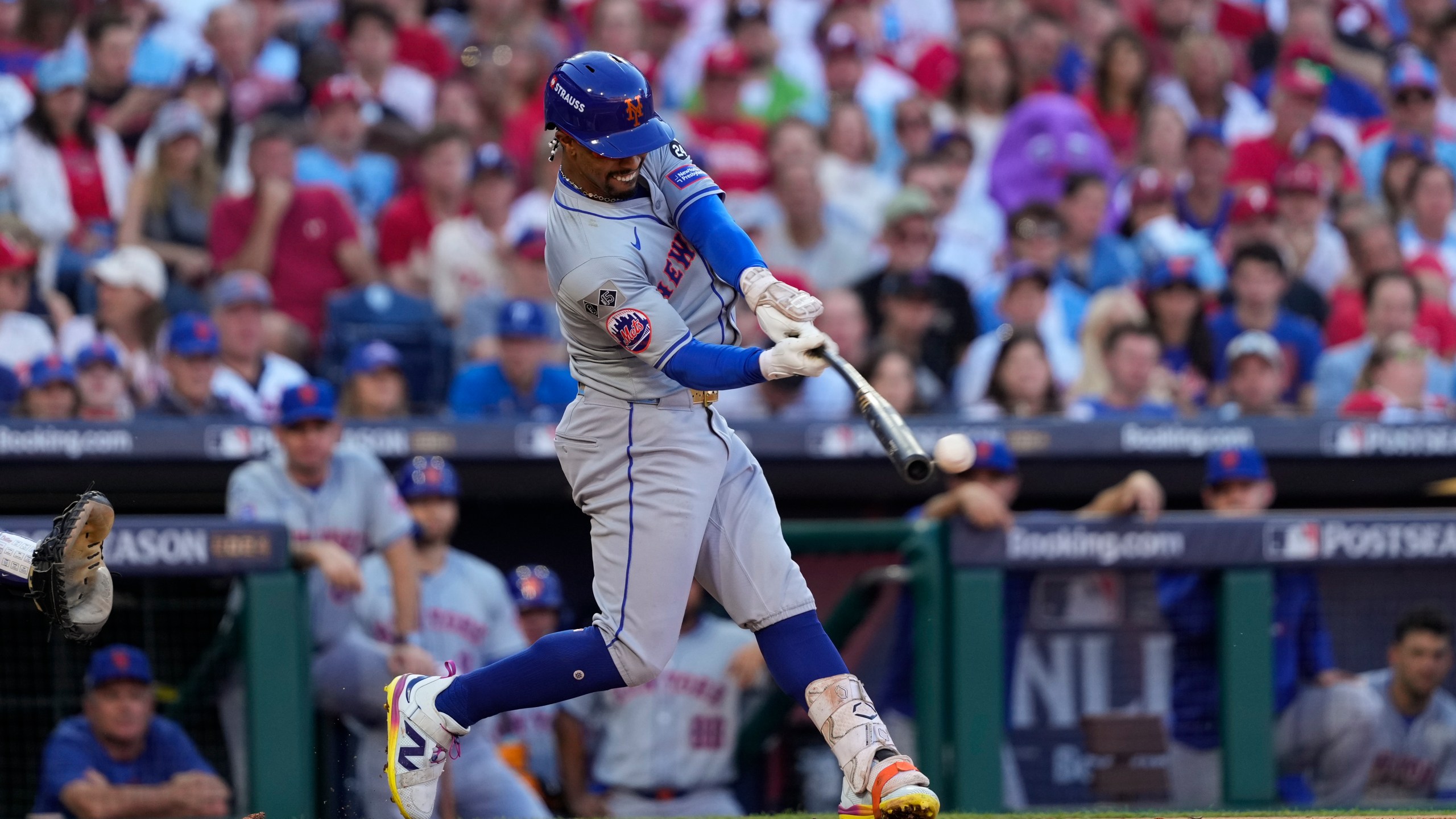 New York Mets' Francisco Lindor hits a single against Philadelphia Phillies pitcher Cristopher Sánchez during the third inning of Game 2 of a baseball NL Division Series, Sunday, Oct. 6, 2024, in Philadelphia. (AP Photo/Matt Slocum)