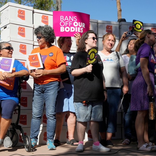 FILE - Arizona abortion-rights supporters gather for a news conference prior to delivering over 800,000 petition signatures to the capitol to get abortion rights on the November general election ballot Wednesday, July 3, 2024, in Phoenix. (AP Photo/Ross D. Franklin, File)