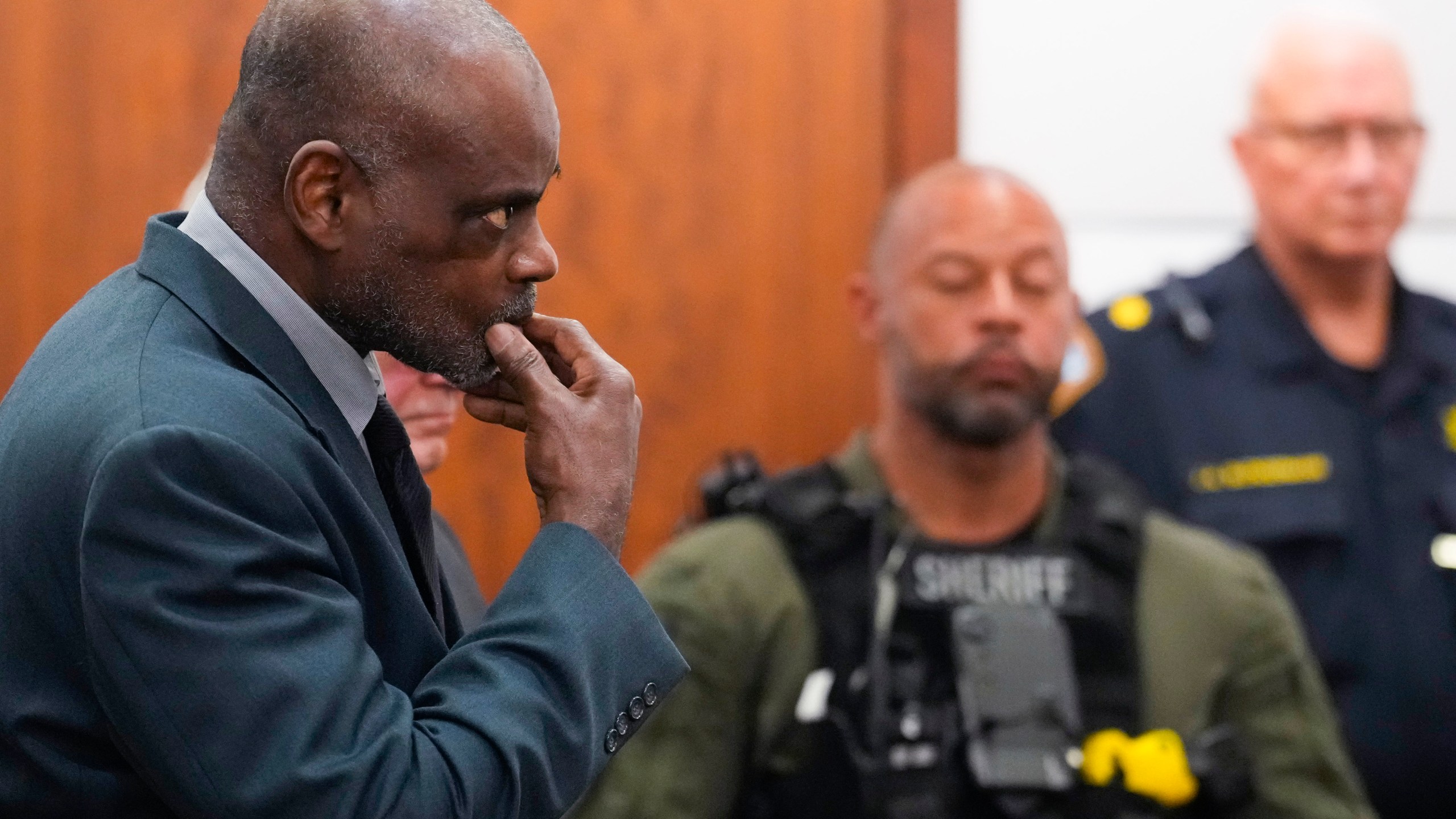 Former Houston Police officer Gerald Goines stands as he is formally sentenced on a pair of felony murder convictions on Tuesday, Oct. 8, 2024, in Houston. Goines was found guilty of felony murder and sentenced to 60 years behind bars in the 2019 deaths of Dennis Tuttle and Rhogena Nicholas. (Brett Coomer/Houston Chronicle via AP)