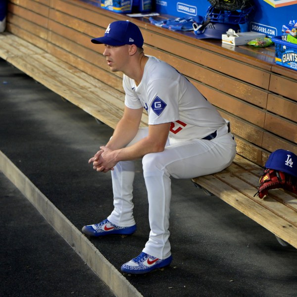 FILE - Los Angeles Dodgers' Walker Buehler sits in the dugout after the first inning of a baseball game against the Seattle Mariners, Tuesday, Aug. 20, 2024, in Los Angeles. (AP Photo/Jayne-Kamin-Oncea, File)