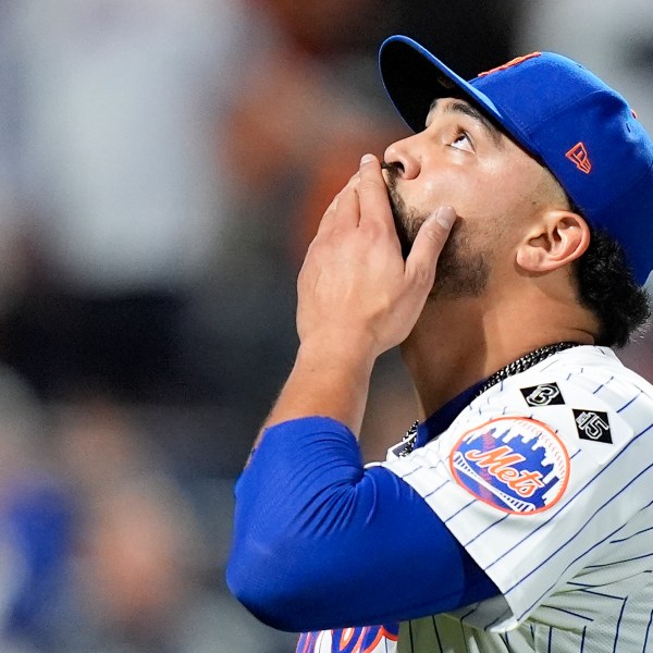 New York Mets pitcher Sean Manaea (59) reacts as he walks off the field at the end of the top of the seventh inning of Game 3 of the National League baseball playoff series against the Philadelphia Phillies, Tuesday, Oct. 8, 2024, in New York. (AP Photo/Frank Franklin II)