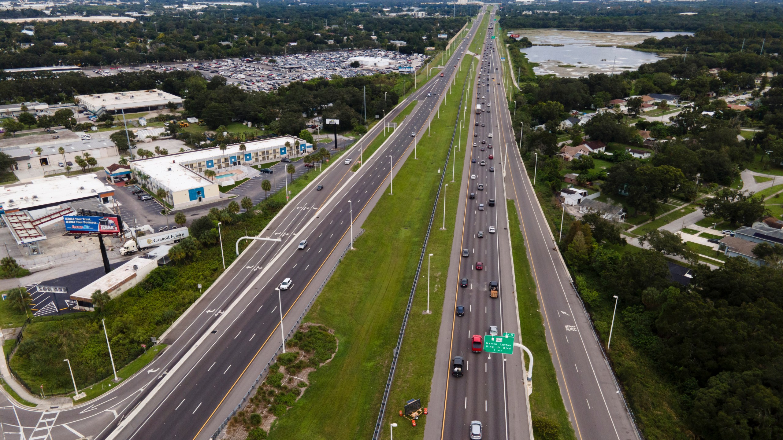 In this image taken with a drone, traffic flows eastbound along Interstate 4 as residents continue to follow evacuation orders ahead of Hurricane Milton, Tuesday, Oct. 8, 2024, in Tampa, Fla. (AP Photo/Julio Cortez)