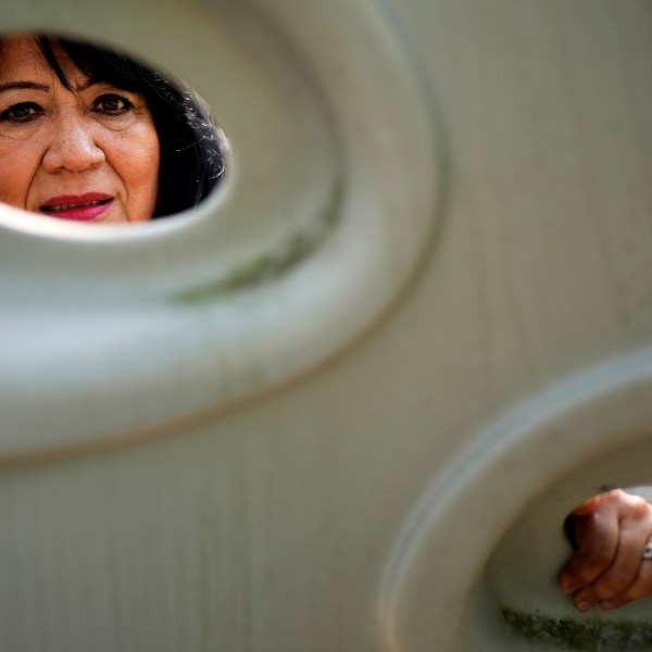 Margaret Padilla Carrasco, 65, who has lived in Waukegan her entire life, poses for a photo in Waukegan, Ill., Monday, Sept. 17, 2024. (AP Photo/Nam Y. Huh)