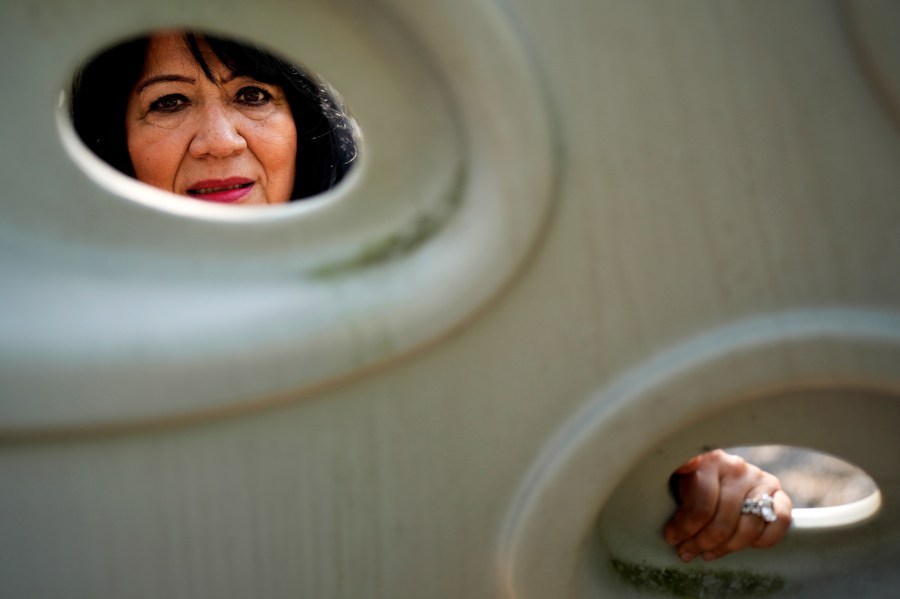 Margaret Padilla Carrasco, 65, who has lived in Waukegan her entire life, poses for a photo in Waukegan, Ill., Monday, Sept. 17, 2024. (AP Photo/Nam Y. Huh)