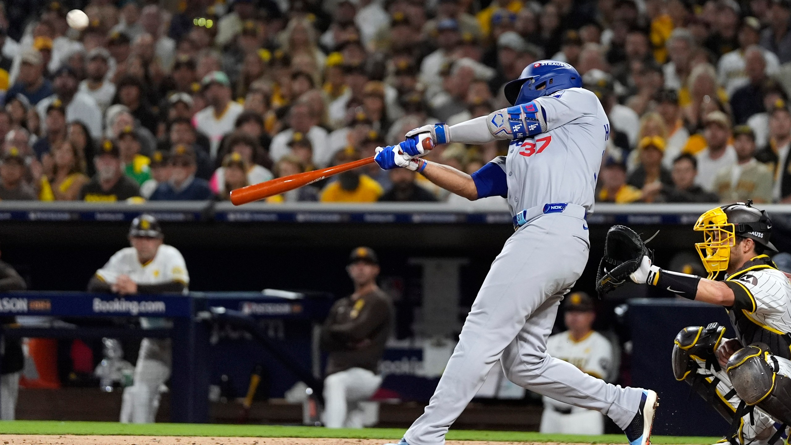 Los Angeles Dodgers' Teoscar Hernández connects for a grand slam during the third inning in Game 3 of a baseball NL Division Series against the San Diego Padres, Tuesday, Oct. 8, 2024, in San Diego. (AP Photo/Gregory Bull)