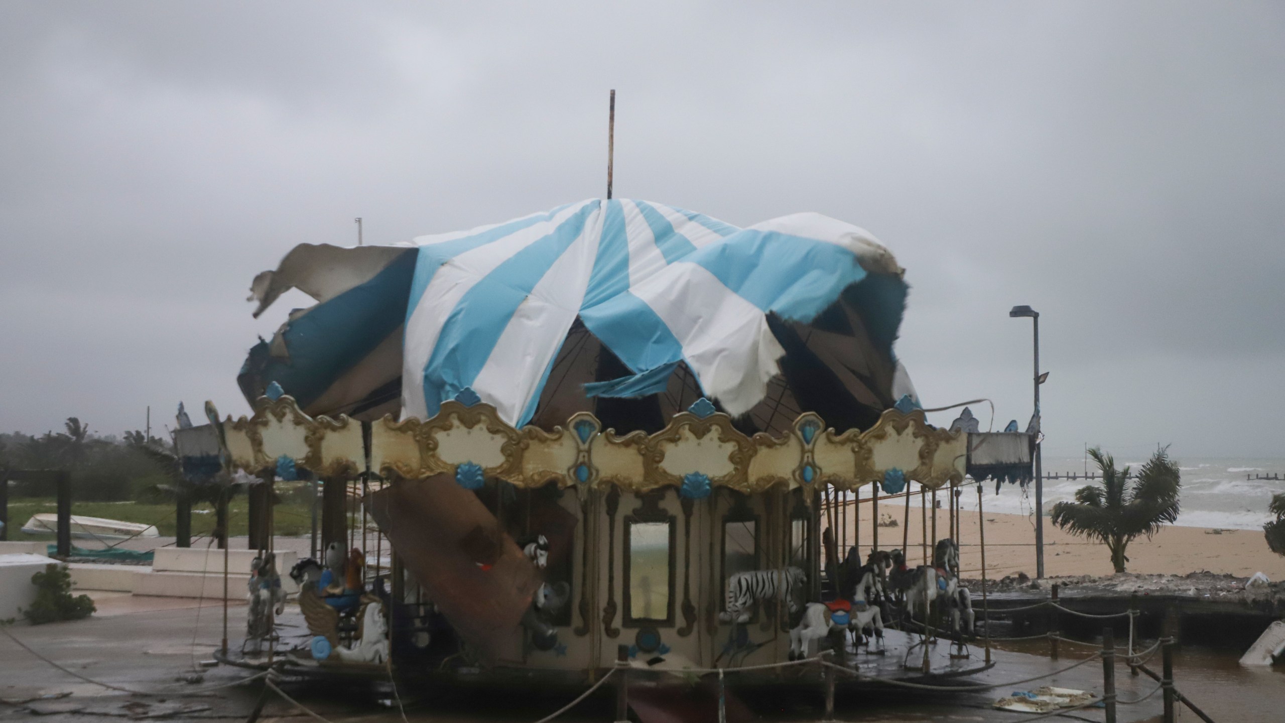 A carousel stands damaged after the eye of Hurricane Milton passed off the coast of Progreso, Yucatan state, Mexico, Tuesday, Oct. 8, 2024. (AP Photo/Martin Zetina)