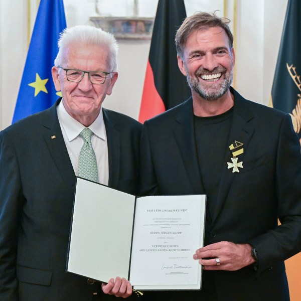 Soccer coach Juergen Klopp, right, receives the Order of Merit of the German State of Baden-Wuerttemberg in Stuttgart, Germany, Tuesday, Oct. 8, 2024, from Governor Winfried Kretschmann, left, for his wide-ranging social commitment outside of sport. (Bernd Weissbrod/dpa via AP)