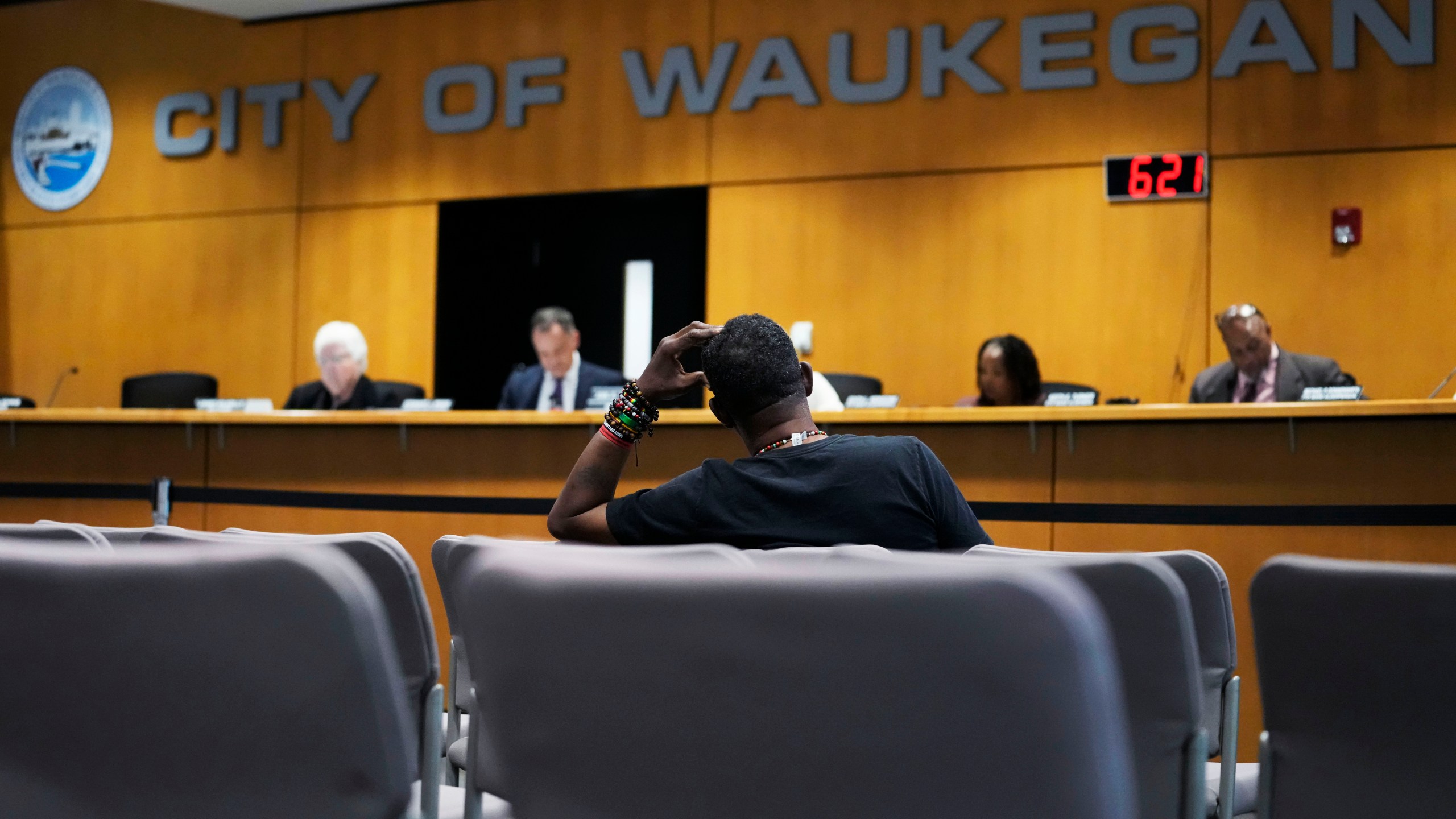 Clyde McLemore, executive director for Black Lives Matter Lake County, listens as he attends the city council meeting in Waukegan, Ill., Monday, Sept. 16, 2024. (AP Photo/Nam Y. Huh)