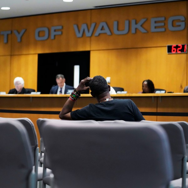 Clyde McLemore, executive director for Black Lives Matter Lake County, listens as he attends the city council meeting in Waukegan, Ill., Monday, Sept. 16, 2024. (AP Photo/Nam Y. Huh)