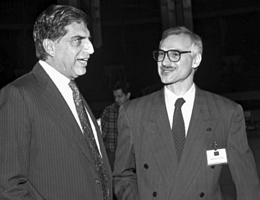 FILE - Leading Indian industrialists Jamshed J. Godrej, right, and Ratan Tata, left, chat during a business meeting in Calcutta, Jan. 4, 1995. (AP Photo, File)