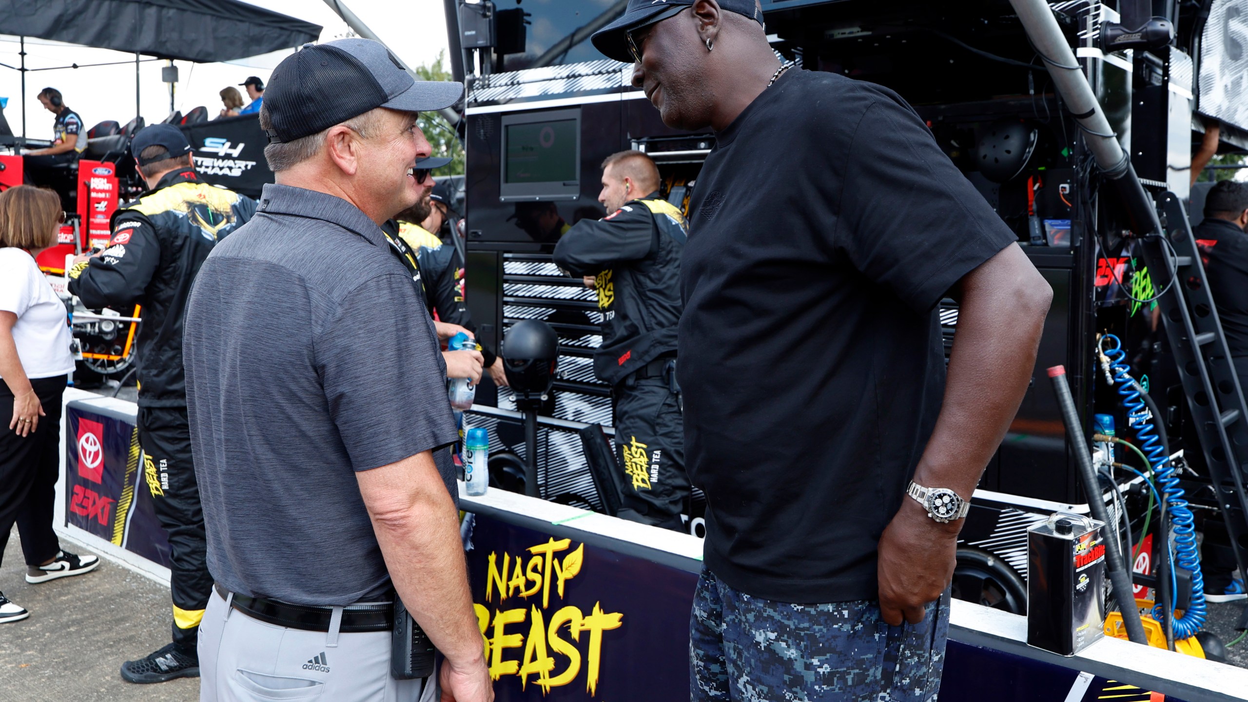 Bob Jenkins, owner of Front Row Motorsports and Co-Owner Michael Jordan, of 23XI Racing, talk before a NASCAR Cup Series auto race at Talladega Superspeedway, Sunday, Oct. 6, 2024, in Talladega, Ala. (AP Photo/ Butch Dill)