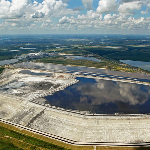 FILE - A sinkhole that opened up underneath a gypsum stack at a Mosaic phosphate fertilizer plant is seen in Mulberry, Fla., on Sept. 16, 2016. (Jim Damaske/Tampa Bay Times via AP, File)