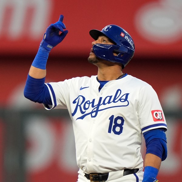 Kansas City Royals' Yuli Gurriel celebrates after hitting a double during the second inning in Game 3 of an American League Division baseball playoff series against the New York Yankees Wednesday, Oct. 9, 2024, in Kansas City, Mo. (AP Photo/Charlie Riedel)