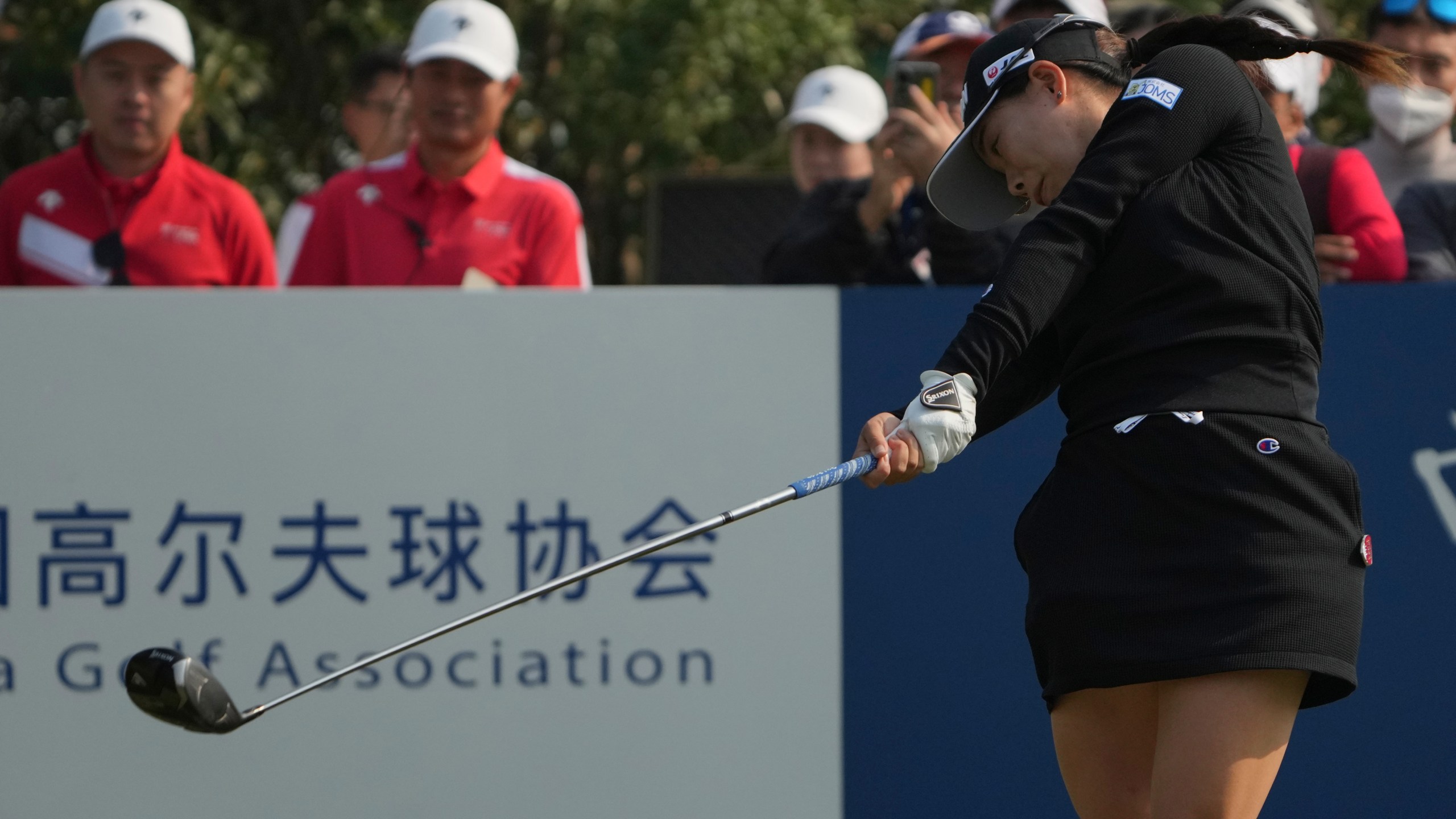 Minami Katsu of Japan tees off on the first hole during the first round of the Buick LPGA Shanghai at Shanghai Qizhong Garden Golf Club in Shanghai, China, Thursday, Oct. 10, 2024. (AP Photo/Achmad Ibrahim)