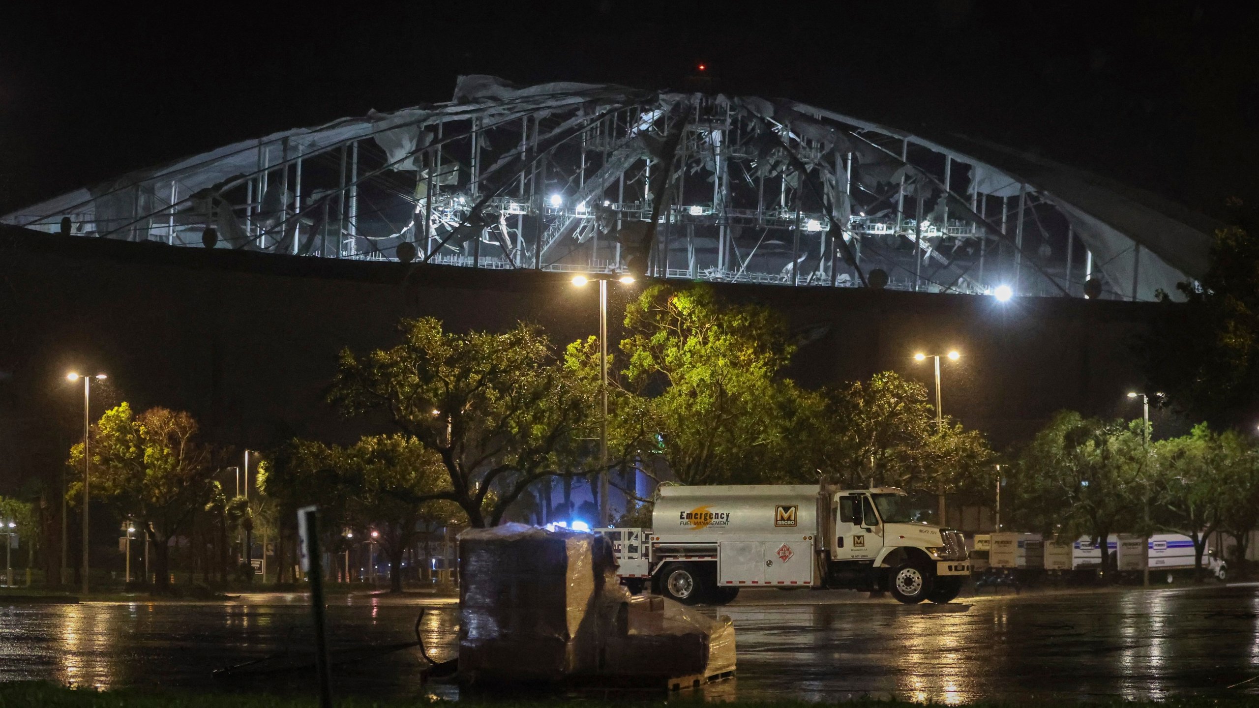 The roof of Tropicana Field, the home of the Tampa Bay Rays, appeared to be badly damaged as Hurricane Milton passes Thursday, Oct. 10, 2024, in St. Petersburg, Fla. (Chris Urso/Tampa Bay Times via AP)