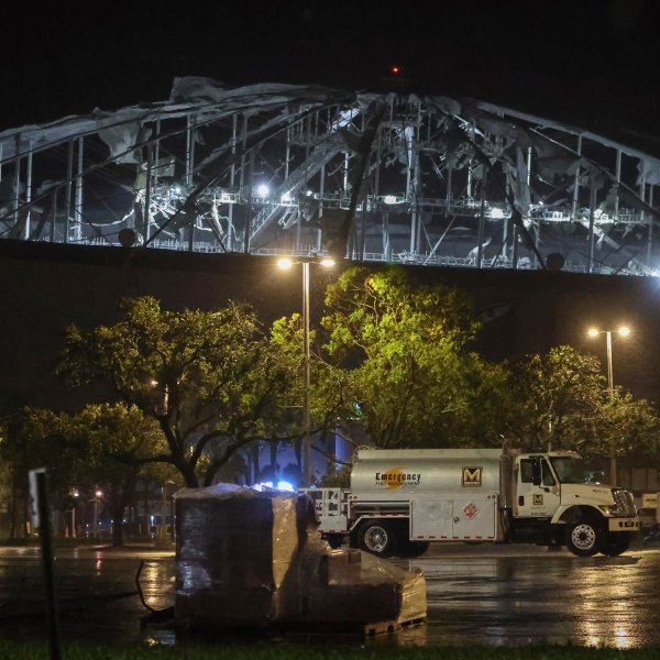 The roof of Tropicana Field, the home of the Tampa Bay Rays, appeared to be badly damaged as Hurricane Milton passes Thursday, Oct. 10, 2024, in St. Petersburg, Fla. (Chris Urso/Tampa Bay Times via AP)