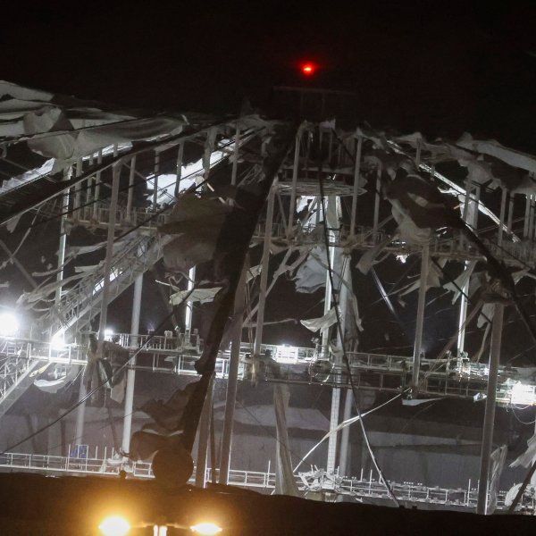 The roof of Tropicana Field, the home of the Tampa Bay Rays, appeared to be badly damaged as Hurricane Milton passes Thursday, Oct. 10, 2024, in St. Petersburg, Fla. (Chris Urso/Tampa Bay Times via AP)