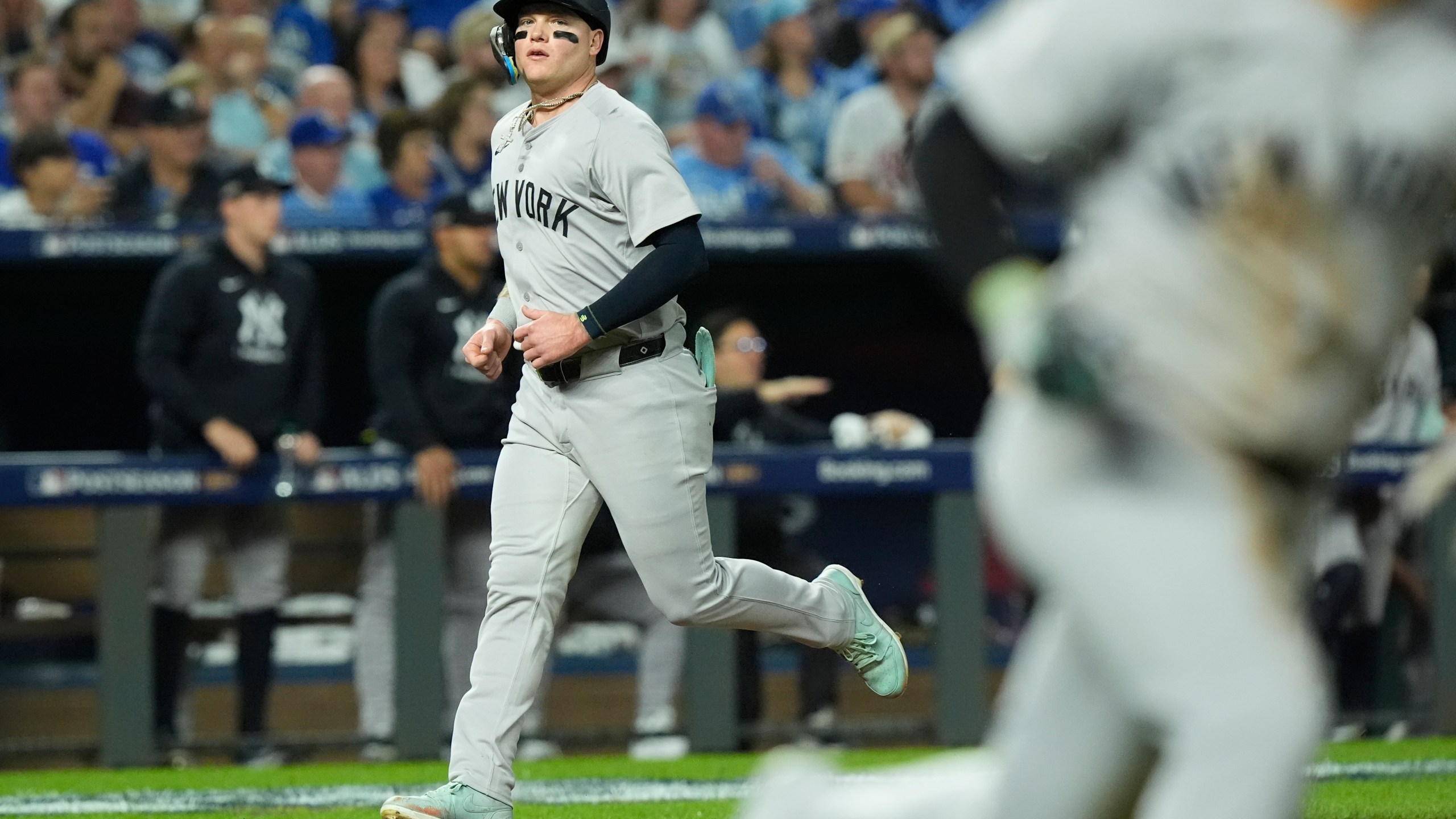 New York Yankees' Alex Verdugo scores during the fifth inning in Game 4 of an American League Division baseball playoff series against the Kansas City Royals Thursday, Oct. 10, 2024, in Kansas City, Mo. (AP Photo/Charlie Riedel)