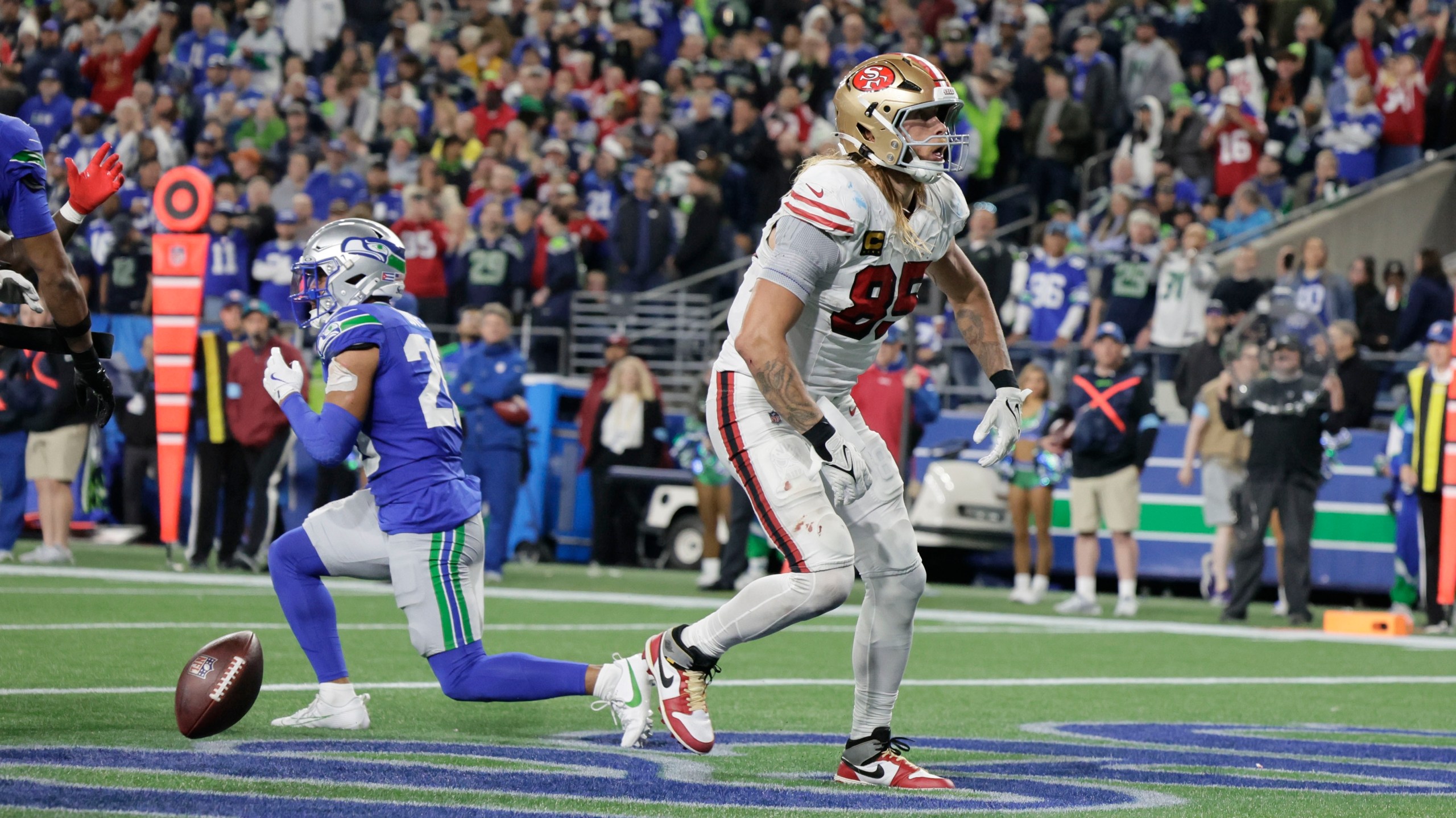 San Francisco 49ers tight end George Kittle reacts after scoring during the second half of an NFL football game against the Seattle SeahawksThursday, Oct. 10, 2024, in Seattle. (AP Photo/John Froschauer)