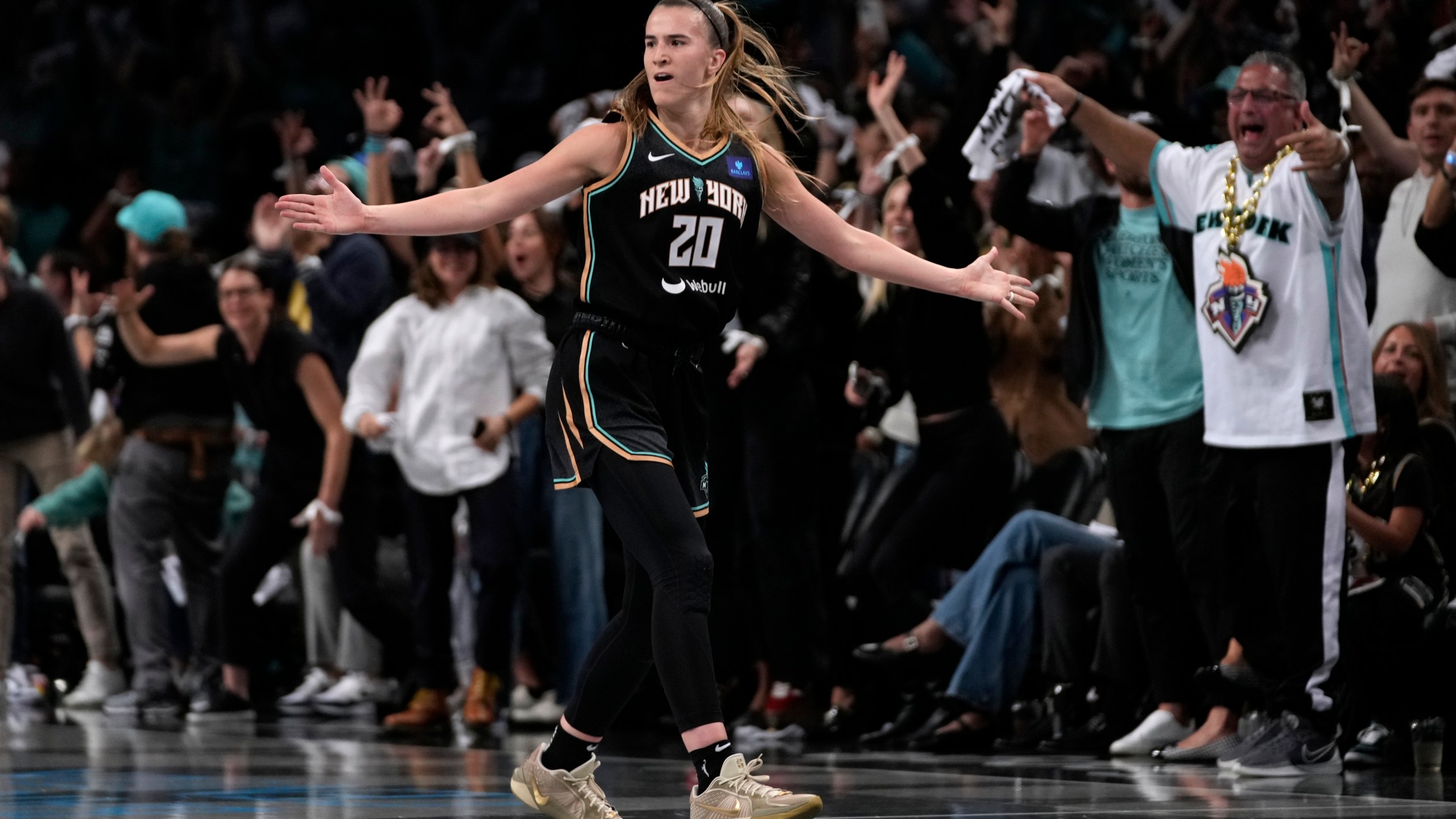 New York Liberty's Sabrina Ionescu (20) reacts after scoring during the first half in Game 1 of a WNBA basketball final playoff series against the Minnesota Lynx, Thursday, Oct. 10, 2024, in New York. (AP Photo/Pamela Smith)