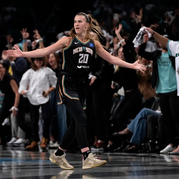 New York Liberty's Sabrina Ionescu (20) reacts after scoring during the first half in Game 1 of a WNBA basketball final playoff series against the Minnesota Lynx, Thursday, Oct. 10, 2024, in New York. (AP Photo/Pamela Smith)