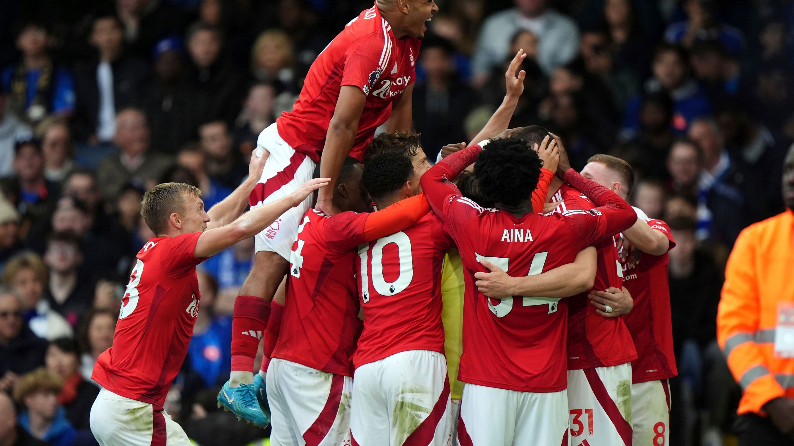 Nottingham Forest's Chris Wood celebrates scoring their side's first goal of the game with team-mates during the English Premier League soccer match between Chelsea and Nottingham Forest at Stamford Bridge in London, Sunday Oct. 6, 2024. (Bradley Collyer/PA via AP)