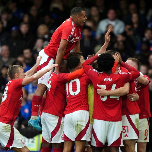 Nottingham Forest's Chris Wood celebrates scoring their side's first goal of the game with team-mates during the English Premier League soccer match between Chelsea and Nottingham Forest at Stamford Bridge in London, Sunday Oct. 6, 2024. (Bradley Collyer/PA via AP)