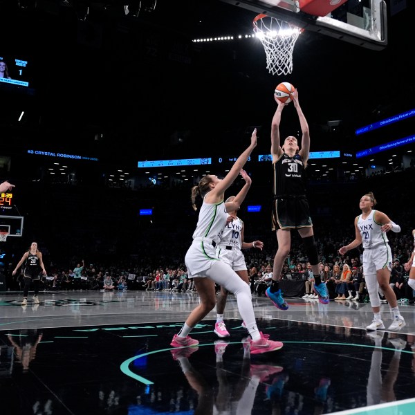 New York Liberty's Breanna Stewart shoots the ball during the first half in Game 1 of a WNBA basketball final playoff series against the Minnesota Lynx, Thursday, Oct. 10, 2024, in New York. (AP Photo/Pamela Smith)