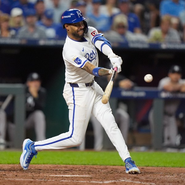 Kansas City Royals' Maikel Garcia singles during the sixth inning in Game 4 of an American League Division baseball playoff series against the New York Yankees Thursday, Oct. 10, 2024, in Kansas City, Mo. (AP Photo/Charlie Riedel)