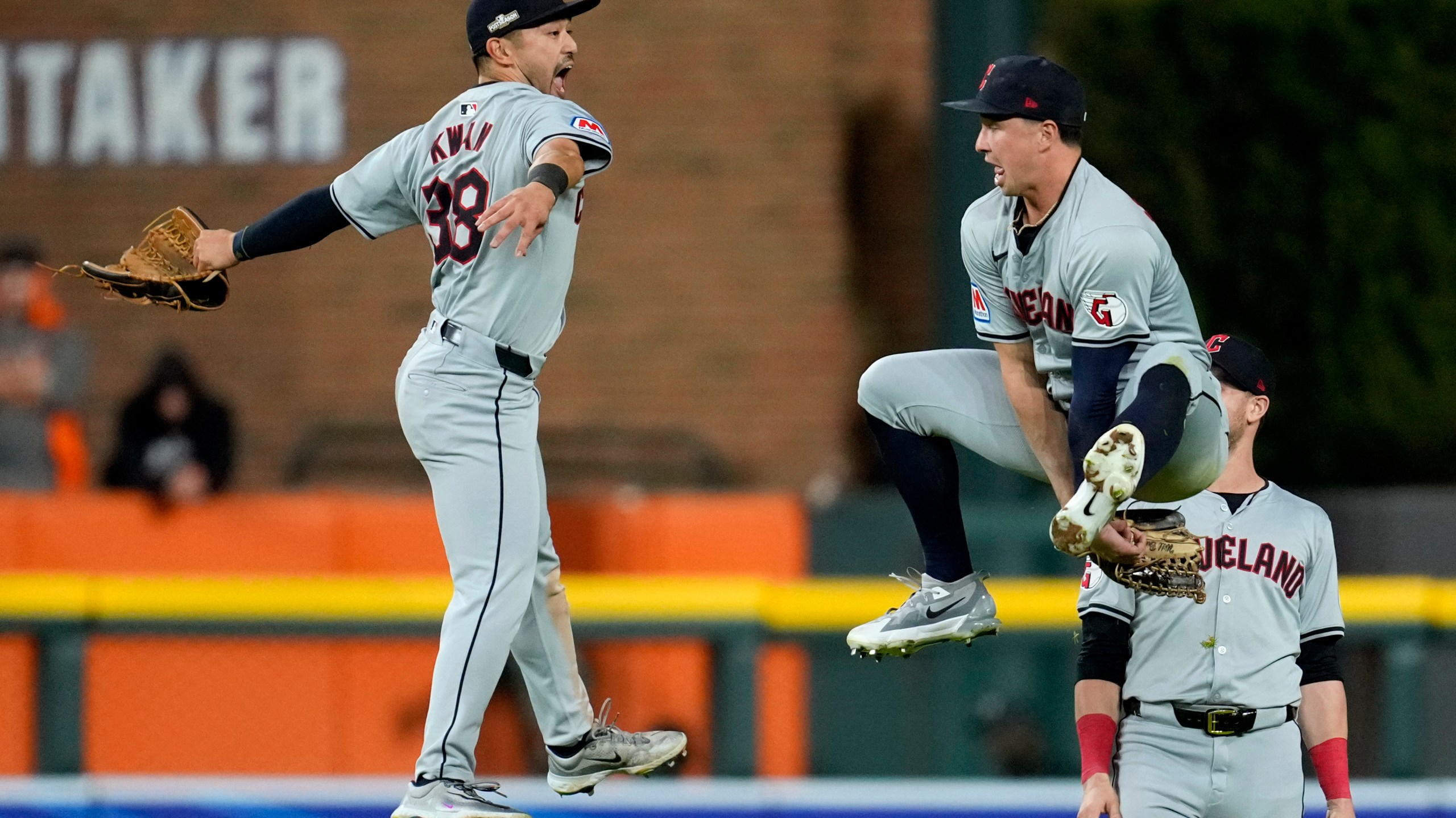 Cleveland Guardians' Steven Kwan (38) celebrates with teammate Will Brennan, right, at the end of Game 4 of a baseball American League Division Series against the Detroit Tigers, Thursday, Oct. 10, 2024, in Detroit. The Guardians won 5-4. (AP Photo/Paul Sancya)