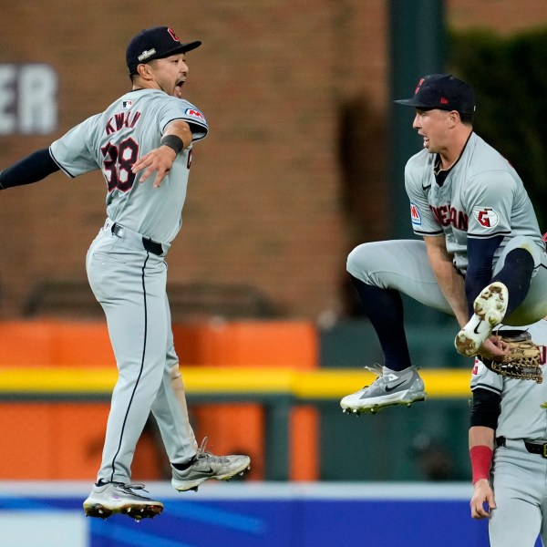 Cleveland Guardians' Steven Kwan (38) celebrates with teammate Will Brennan, right, at the end of Game 4 of a baseball American League Division Series against the Detroit Tigers, Thursday, Oct. 10, 2024, in Detroit. The Guardians won 5-4. (AP Photo/Paul Sancya)