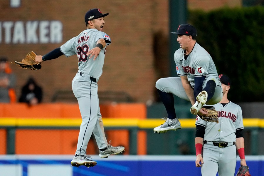 Cleveland Guardians' Steven Kwan (38) celebrates with teammate Will Brennan, right, at the end of Game 4 of a baseball American League Division Series against the Detroit Tigers, Thursday, Oct. 10, 2024, in Detroit. The Guardians won 5-4. (AP Photo/Paul Sancya)