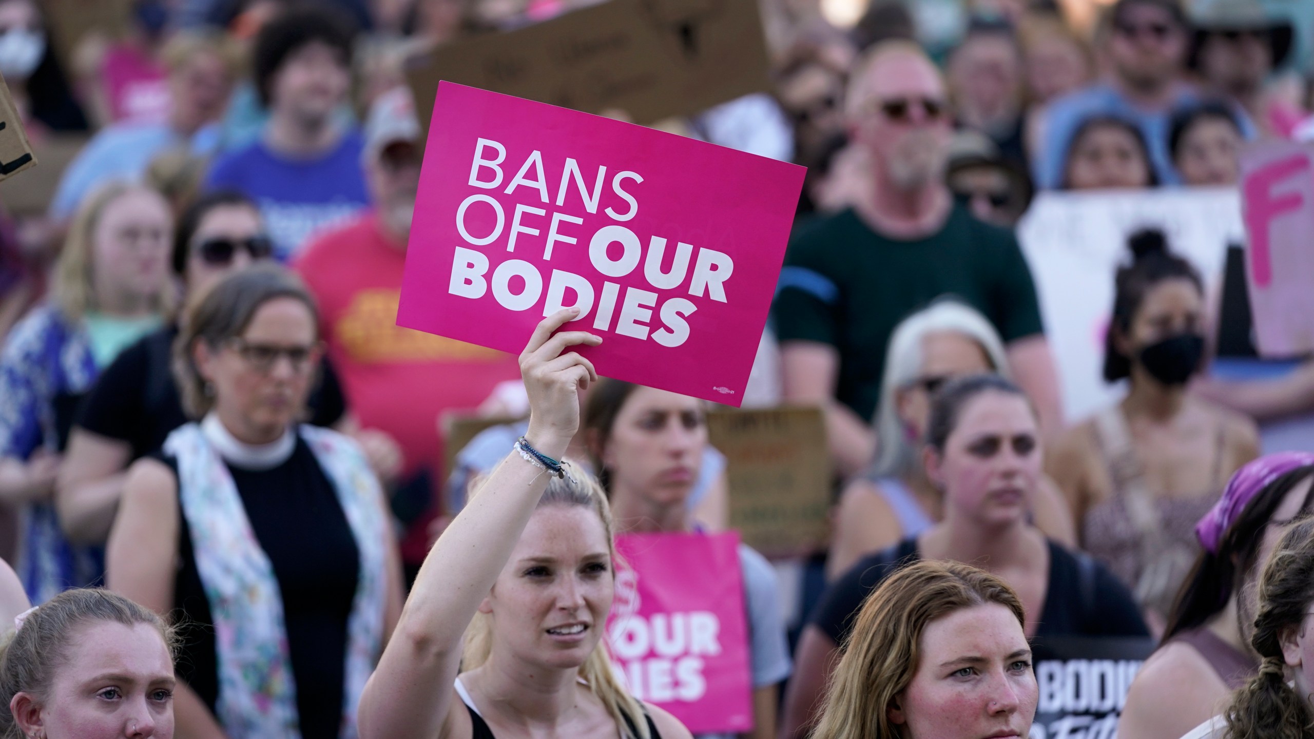 FILE - Abortion-rights protesters cheer at a rally outside the state capitol in Lansing, Mich., June 24, 2022. (AP Photo/Paul Sancya, File)